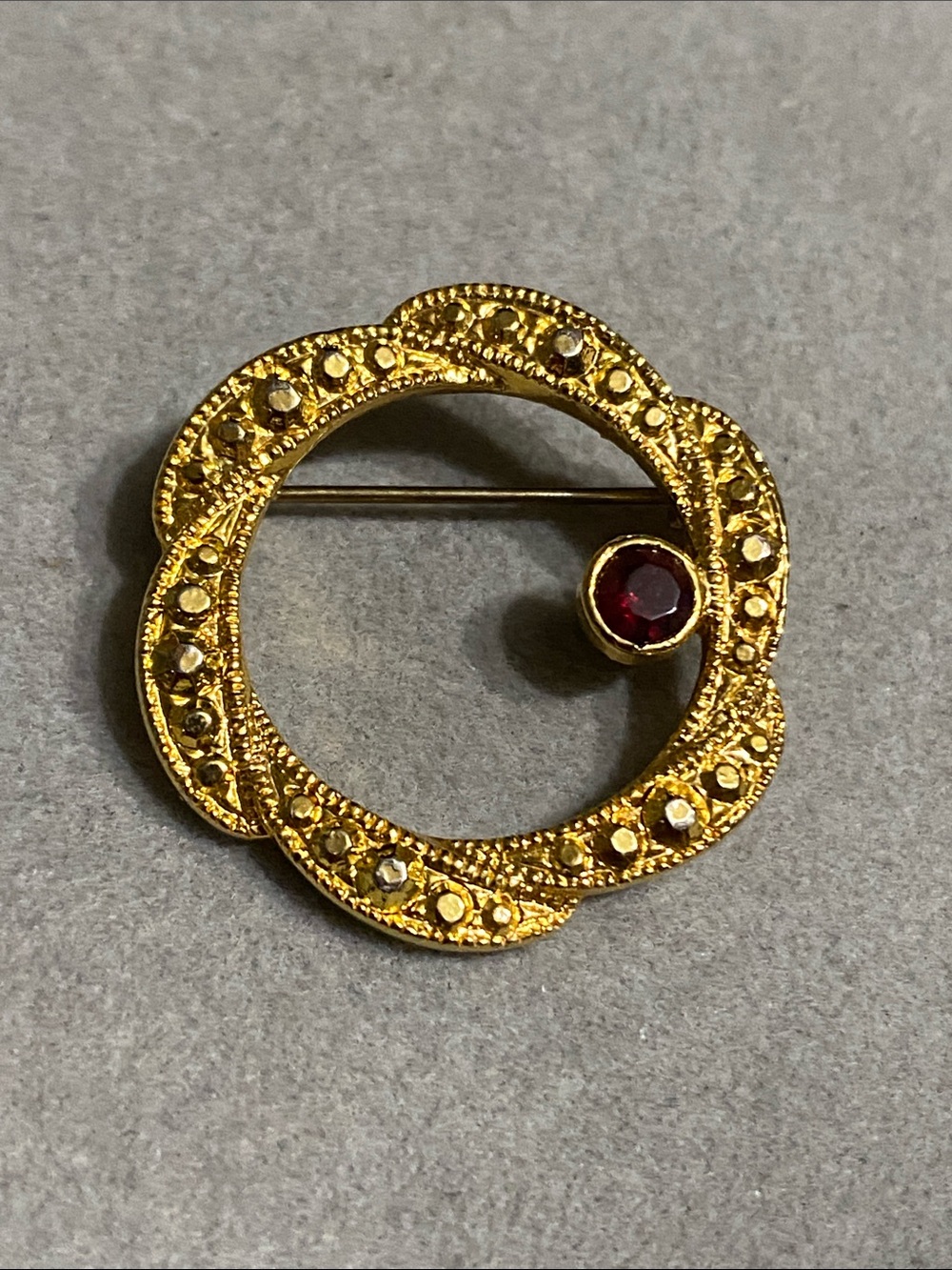 Gold-Tone Circle Brooch with Red Stone Accent